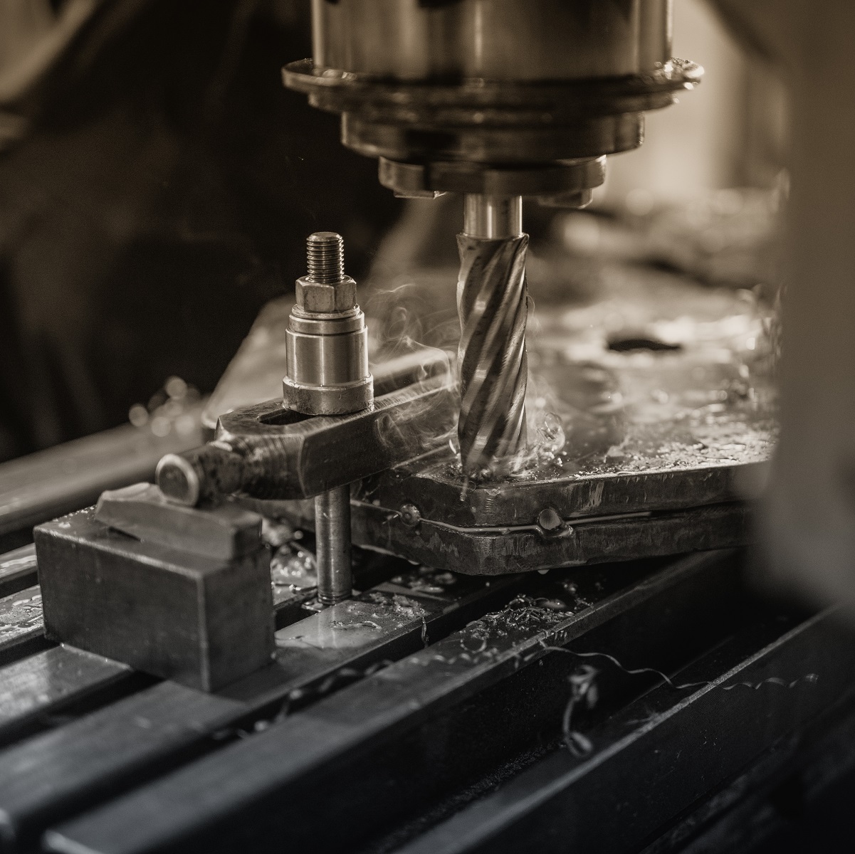 Industrial machine drilling metal.